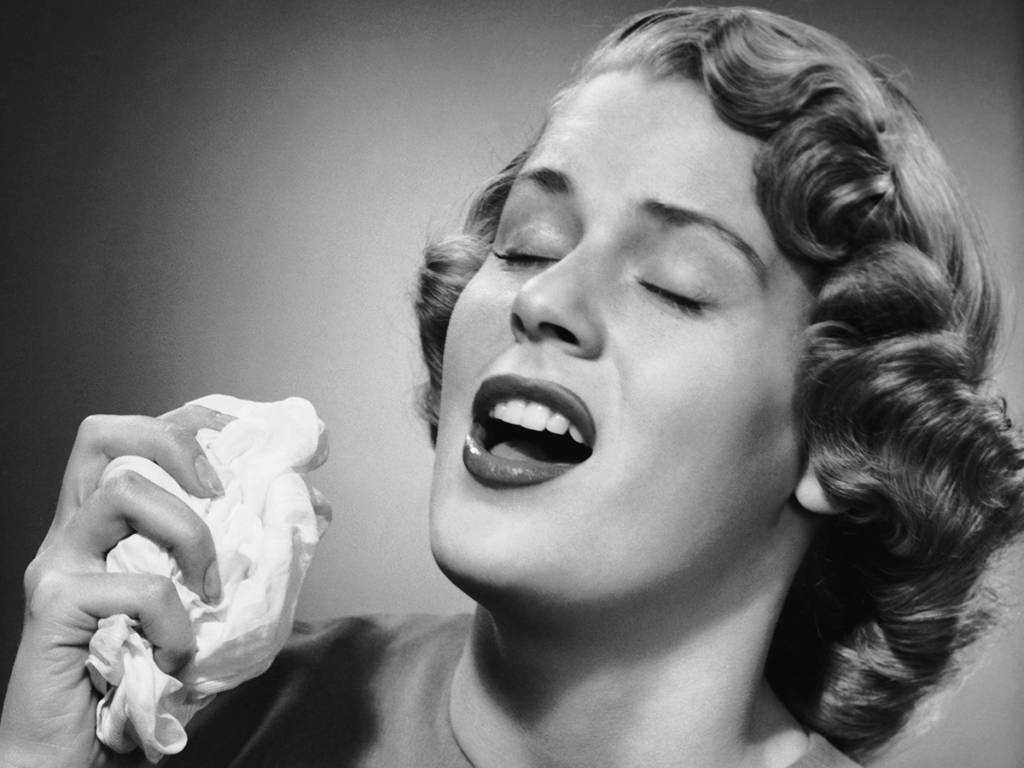 Woman sneezing