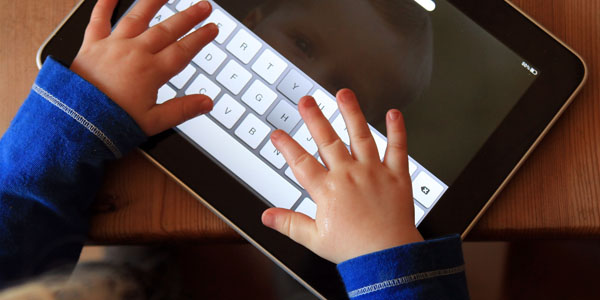 Children Interacting With Tablet Technology