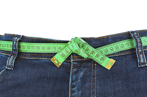 Jeans and measuring tape – slimming concept