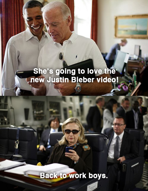 U.S. Secretary of State Hillary Clinton checks her PDA upon her departure in a military C-17 plane from Malta bound for Tripoli,  Libya