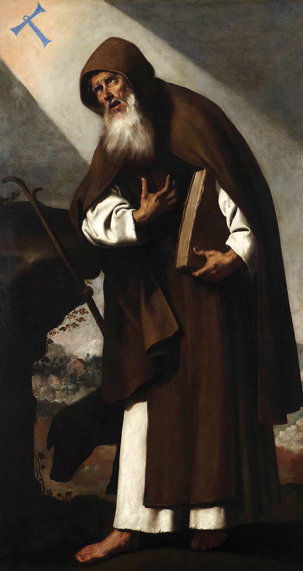 Imagem de Santo Antão, um homem barbudo com um capuz marrom. Ele segura um livro enquanto olha para cima