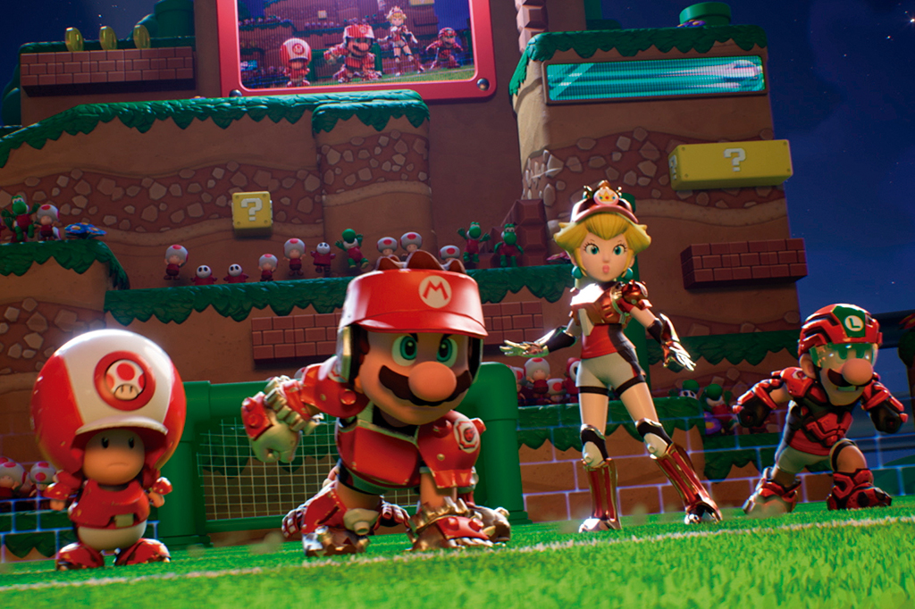 Frame do jogo em que aparece Mario e seus conterrâneos em um campo de futebol.