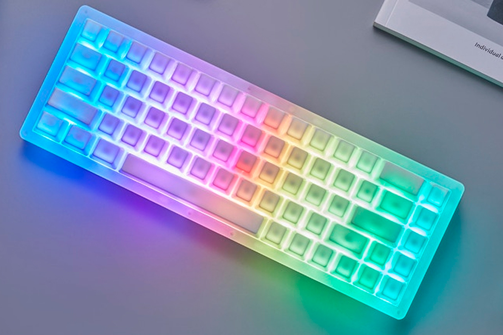 Ceramic keyboard, white, illuminated by colored lights.
