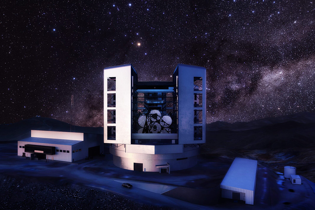 Renderização do exterior do telescópio, em cena noturna, com com edifícios de suporte em volta.