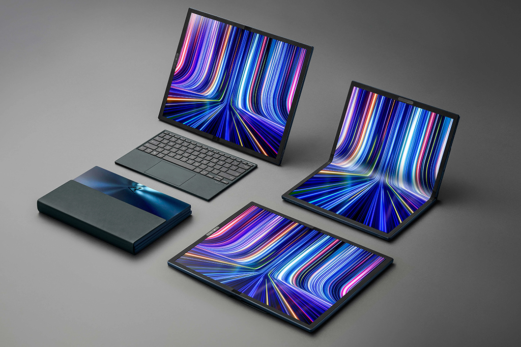 O notebook Asus Zenbook 17 OLED Fold disposto em diferentes formas em um fundo cinza de estúdio.