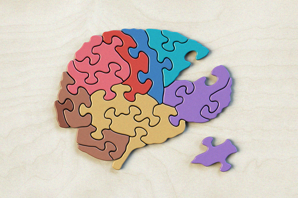 Foto de um quebra-cabeça em formato de cérebro com uma peça fora do lugar.