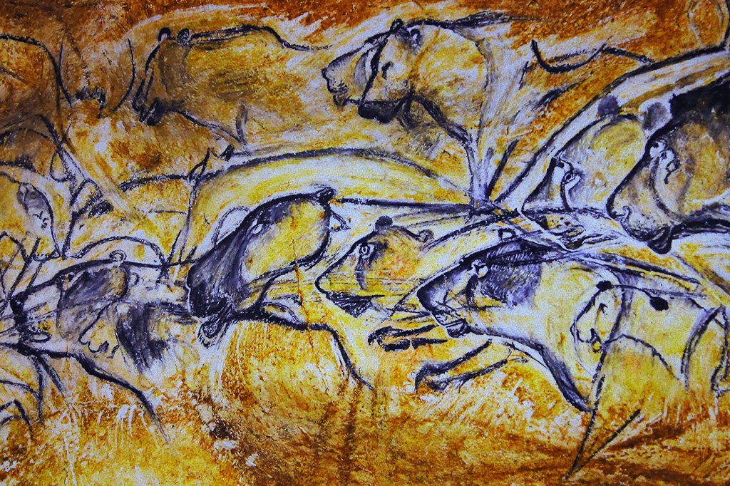 Detalhe de uma pintura rupestre feita na Caverna de Chauvet, na França, mostrando várias leoas desenhadas uma por cima da outra, como frames de animação.
