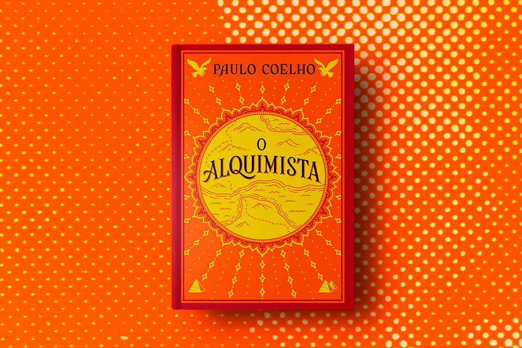 Livro O Alquimista sobre fundo laranja.