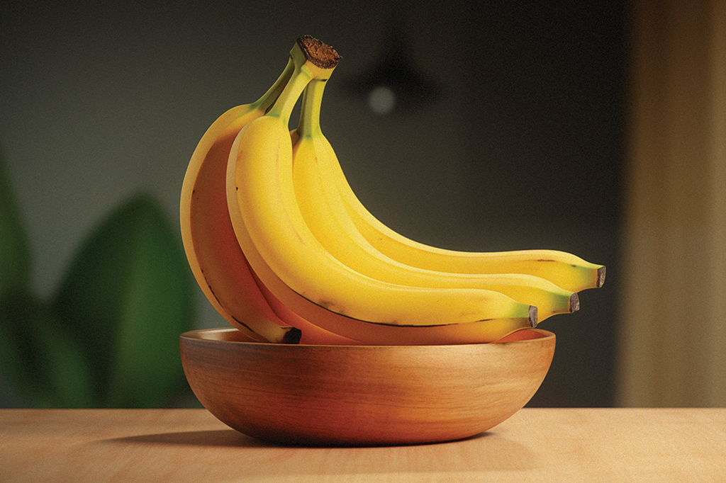 Imagem de um cacho de banana dentro de um pote.