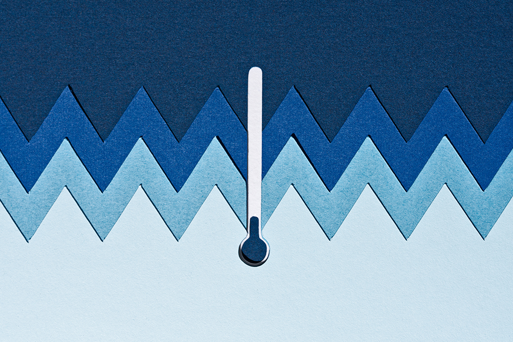 Ilustração de recortes de papel de um termômetro azul mostra temperatura extremamente baixa.