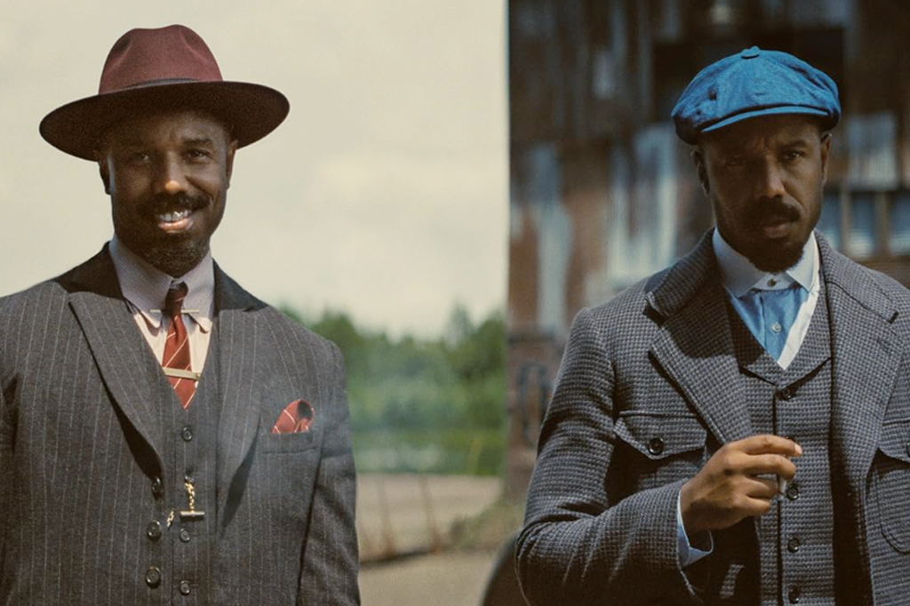 Imagem de dois homens usando terno e chapéu.