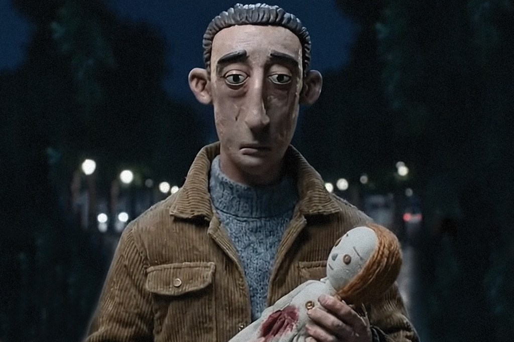 Imagem, feita de massinha, de um homem triste segurando uma boneca.